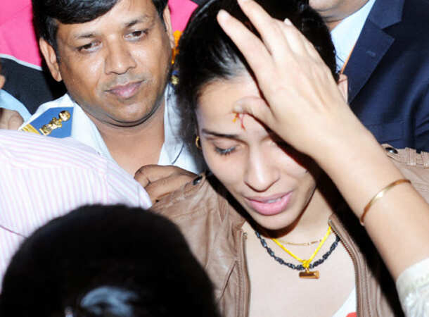 Champion Saina returns home 
