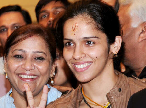 Champion Saina returns home 