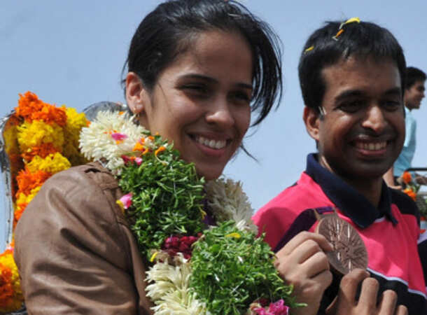 Champion Saina returns home 