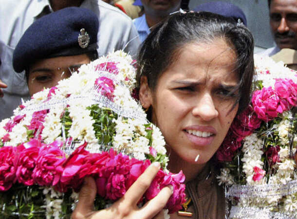 Champion Saina returns home 