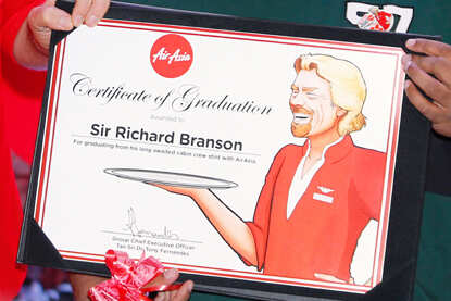 Richard Branson dresses up as AirAsia flight attendant