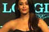 Ash walks the ramp at the launch of Longines watches
